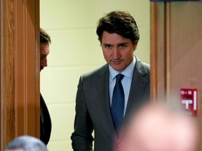 Prime Minister Justin Trudeau makes his entrance at the Public Inquiry Into Foreign Interference in Federal Electoral Processes and Democratic Institutions in Ottawa on Wednesday, April 10, 2024.