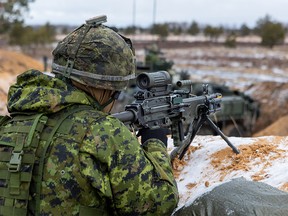Members of the Canadian army take part in a NATO exercise in Adazi, Latvia, on March 7, 2022.