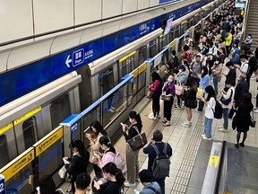 Taipei commuters wait for a train during an earthquake.