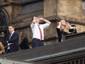 Prime Minister Justin Trudeau watches the solar eclipse.