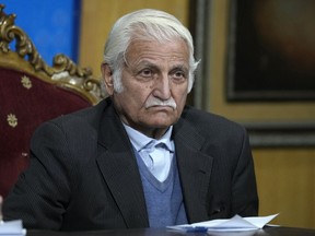FILE - Farhatullah Babar, a veteran human rights activist and member of the Human Rights Commission of Pakistan, listens to a reporter during a news conference, in Islamabad, Pakistan, Monday, Jan. 1, 2024. Babar, an important ally of Pakistani Prime Minister Shehbaz Sharif, demanded the government lift a two-month-old ban on the social media platform X, saying it violates citizens' right to speech and expression.