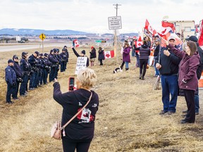 RCMP officers and anti-carbon tax protesters.