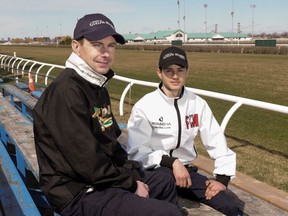 Jockey David Moran (left) sits with his son, apprentice jockey Pietro Moran, at Woodbine Racetrack in Toronto on Wednesday, April 10, 2024.