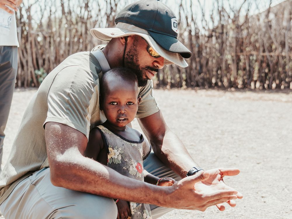 NextImg:Edmonton Elks receiver Eugene Lewis says mission to Africa changed his life