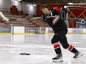 Landon DuPont takes part in a media event in Calgary in a Monday, April 8, 2024 handout photo. Hockey Canada granted Landon DuPont, a 14-year-old defenceman from Calgary, exceptional player status.