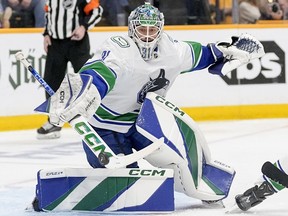 Vancouver Canucks goaltender Arturs Silovs (31) blocks a shot on goal against the Nashville Predators during the second period in Game 4 of an NHL hockey Stanley Cup first-round playoff series Sunday, April 28, 2024, in Nashville, Tenn.