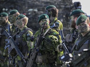 Swedish soldiers during the military exercise Aurora 23 at Berga naval base outside Stockholm, Friday, April 28, 2023. A Swedish parliament committee on Friday, April 26, 2024, said Sweden which recently joined NATO, should increase its military budget by nearly 54 billion kronor ($5 billion) until 2030 to strengthen the Scandinavian country's air defense and increase the number of conscripts, among others.