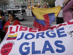 Supporters of former Vice President Jorge Glas cheer after an Ecuadorian court of justice declared that his arrest inside Mexico's embassy was illegal, in Quito, Ecuador, Friday, April 12, 2024. However the court ordered that Glas remain in prison to serve a pending sentence for two corruption cases in which he was convicted.