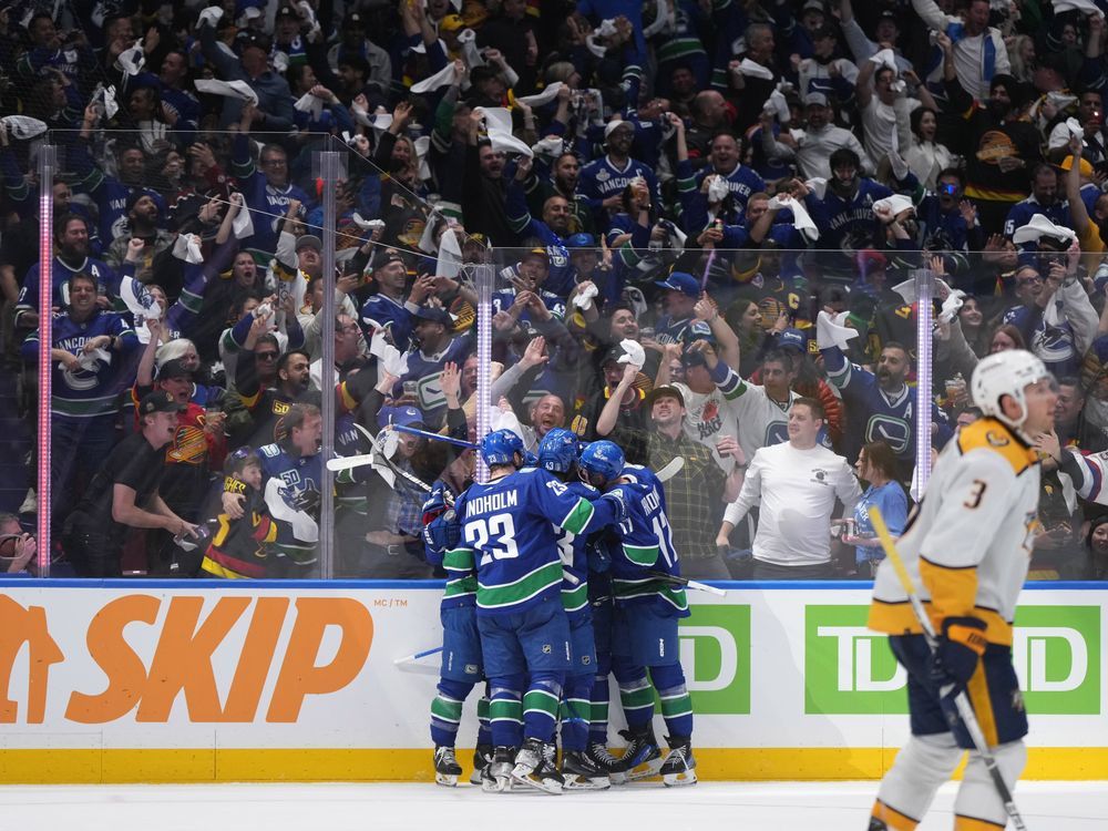 NextImg:Vancouver Canucks claw out 4-2 comeback win over Nashville Predators in Game 1