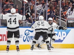 Los Angeles Kings' Mikey Anderson (44), Quinton Byfield (55) and Anze Kopitar (11) celebrate Kopitar's game-winning goal against the Edmonton Oilers during overtime NHL playoff action in Edmonton on Wednesday April 24, 2024.