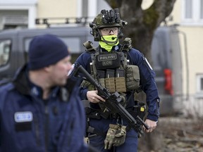 Police officers at the primary Viertola comprehensive school where a child opened fire and injured three other children, on April 2, 2024 in Vantaa, outside the Finnish capital Helsinki.