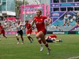 Canada's Ethan Hager races away from the Britain defence at the Cathay/HSBC Hong Kong Sevens in Hong Kong in a Sunday, April 7, 2024, handout photo.