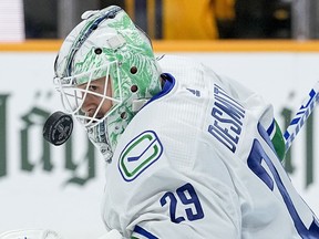 Vancouver Canucks goaltender Casey DeSmith (29) warms up before the start of Game 3 in an NHL hockey Stanley Cup first-round playoff series against the Nashville Predators, in Nashville, Tenn., Friday, April 26, 2024.
