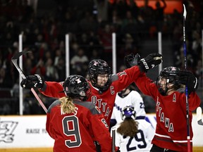 Ottawa's Brianne Jenner (19) celebrates her second goal of the game against Minnesota with Daryl Watts (9) and Emily Clark (26) during second period PWHL hockey action in Ottawa, on Saturday, April 20, 2024.