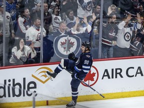 Winnipeg Jets' Nikita Chibrikov (90) celebrates his game-winning goal against the Vancouver Canucks during third period NHL action in Winnipeg on Thursday, April 18, 2024.