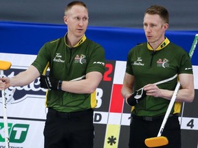 The so-called free agency period at the start of an Olympic quadrennial is typically the high-water mark for curling team adjustments and player movement. Team Northern Ontario skip Brad Jacobs, left, and third Marc Kennedy discuss strategy as they play Team Manitoba at the Brier in Calgary, Alta., Wednesday, March 10, 2021.