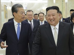 In this photo provided by the North Korean government, North Korean leader Kim Jong Un, right, meets Zhao Leji, chairman of the National People's Congress of China, in Pyongyang, North Korea Saturday, April 13, 2024.