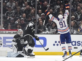 Edmonton Oilers left wing Evander Kane, right, celebrates his goal as Los Angeles Kings goaltender Cam Talbot, left, and center Anze Kopitar look on during the second period in Game 3 of an NHL hockey Stanley Cup first-round playoff series Friday, April 26, 2024, in Los Angeles.