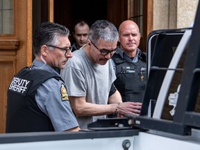 Former RCMP officer Bernie Herman exits the Court of King's Bench in custody following a sentencing hearing after he was found guilty of manslaughter in the shooting death of his lover, 26-year-old Braden Herman (the two men are not related), in Prince Albert, Sask., Thursday, April 25, 2024.