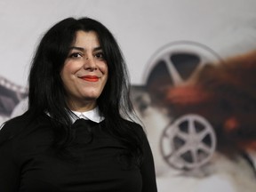 FILE - Director, illustrator and author Marjane Satrapi poses for photographers as she arrives to present the movie "La Bande des Jotas" at the 7th edition of the Rome International Film Festival in Rome, on Nov. 16, 2012. Marjane Satrapi, the acclaimed Iranian-French filmmaker and artist, has won the 2024 Princess of Asturias Foundation award for communication and humanities, the foundation announced Tuesday April 30, 2024.
