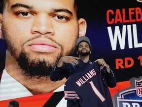 Southern California quarterback Caleb Williams celebrates after being chosen by the Chicago Bears with the first overall pick during the first round of the NFL football draft, Thursday, April 25, 2024, in Detroit.