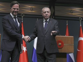 FILE -Turkish President Recep Tayyip Erdogan, right, and Dutch Prime Minister Mark Rutte shake hands at the end of joint news conference, in Ankara, Turkey, Tuesday, March 22, 2022. Turkey has told its NATO allies that Ankara will back the Netherlands' outgoing Prime Minister Mark Rutte's candidacy for the military alliance's secretary general position, a senior Turkish official said Monday, April 29, 2024.