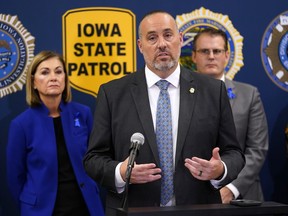 FILE - Iowa Dept. of Public Safety Commissioner Stephan Bayens speaks during a news conference about the Iowa National Guard and Iowa Department of Public Safety deployment to the southern border, Wednesday, Oct. 25, 2023, in Des Moines, Iowa. Attorneys for more than two dozen Iowa and Iowa State athletes who were ensnared in a state gambling sting filed a civil lawsuit Friday, April 26, 2024, seeking unspecified monetary damages from the state and its public safety and criminal investigation agencies for violating the athletes' constitutional rights and smearing their reputations. Among the defendants are Department of Public Safety commissioner Stephan Bayens, DCI director Paul Feddersen, DCI assistant director David Jobes, DCI special agent for sports wagering Troy Nelson, and special agent Brian Sanger.