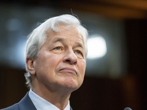 FILE - Jamie Dimon, Chairman and CEO, JPMorgan Chase & Co., listens during a Senate Banking, Housing, and Urban Affairs Committee oversight hearing to examine Wall Street firms on Capitol Hill, Wednesday, Dec. 6, 2023 in Washington. Dimon says stagflation could be one of a number of possible outcomes for the economy as the Federal Reserve attempts to tame stubbornly high consumer prices, Friday, April 26, 2024.