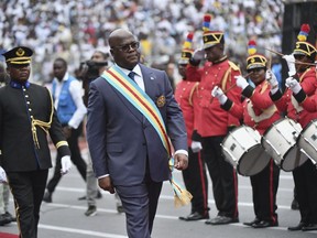 FILE - Congo's President Felix Tshisekedi reviews an honor guard during his swearing-in ceremony for a second term in Kinshasa, Democratic Republic of the Congo, Saturday, Jan. 20, 2024. Tshisekedi appointed the country's first female prime minister on Monday, April 1, fulfilling a campaign promise and making an important step towards the formation of a new government after being reelected late last year.
