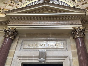FILE - The entrance to the Wisconsin Supreme Court chambers is seen in the state Capitol in Madison, Wis. March 14, 2024. The Wisconsin Supreme Court ruled Tuesday, April 30, 2024, that a former Milwaukee police officer was properly fired for posting racist memes related to the arrest of an NBA player that triggered a public outcry.