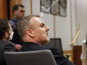FILE - Brian Steven Smith watches proceedings during the opening day of his double murder trial, Tuesday, Feb. 6, 2024, in Anchorage, Alaska. Federal prosecutors want to revoke the U.S. citizenship of Smith, a South Africa man convicted of killing two Alaska Native women for allegedly lying on his naturalization application for saying he had neither killed nor hurt anyone.