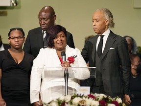 FILE -Bettersten Wade speaks to the attendees of her son Dexter Wade's funeral service in Jackson, Miss. Monday, Nov. 20, 2023. Looking on are the Rev. Al Sharpton, right, who delivered the eulogy, civil rights attorney Ben Crump, background, and one of her son's daughters, Jaselyn Thomas. Bettersten Wade, a woman who sued Mississippi's capital city over the death of her brother has decided to reject a settlement after officials publicly disclosed how much the city would pay his survivors, her attorney said Wednesday.
