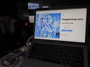 FILE - The X logo is shown on a computer screen in Belgrade, Serbia, July 24, 2023. X, the platform formerly known as Twitter, has started restoring complimentary blue checks to some "influential" users.