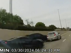 In this screen grab taken from dash camera video provided by Bill Nabors, two speeding sports cars, left and second from left, cause a chain-reaction crash on the North Central Expressway, in Dallas, Saturday, March 30, 2024.