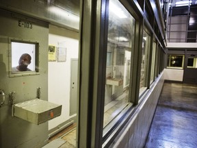 FILE - An inmate looks out of his cell in the the Special Management Unit, known as high-max at the Georgia Diagnostic and Classification Prison, Dec. 1, 2015, in Jackson, Ga. The Special Management Unit of the Georgia Diagnostic and Classification Prison houses some of the state's most violent offenders. In a damning ruling, U.S. District Judge Marc Treadwell said Friday, April 19, 2024, that prison officials showed no desire or intention to make the required changes to SMU's solitary confinement practices.