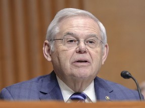 FILE - Sen. Bob Menendez, D-N.J., asks a question during a Senate Finance Committee hearing on Capitol Hill Thursday, March 14, 2024, in Washington. Menendez's bribery trial was moved forward a week to mid-May on Friday, April 18, 2024, after lawyers agreed the extra days would aid trial preparation.