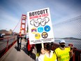 Protesters of Beijing 2022 march across the Golden Gate Bridge on Feb. 3, 2022.