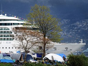 Scenes from the homeless encampment at Crab Park with a cruise ship docked at Canada Place as the City continues to remove tents from sidewalks in the Downtown Eastside of Vancouver, BC., on April 23, 2023.