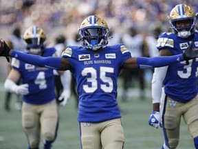 Winnipeg Blue Bombers' Demerio Houston (35) celebrates his interception against the Hamilton Tiger-Cats during first-half CFL action in Winnipeg Friday, June 9, 2023. Houston hopes new Calgary Stampeders teammate Jake Maier doesn't hold grudges. Houston intercepted Maier twice last season as a member of the Blue Bombers, returning one 45 yards for a touchdown. Houston joined the Stampeders in free agency, signing a two-year deal with Calgary.