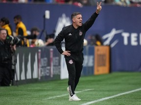Toronto FC head coach John Herdman shouts instructions from the sideline during second half MLS soccer action against the Vancouver Whitecaps, in Vancouver, B.C., Saturday, April 6, 2024. Toronto FC and the New England Revolution are both looking to climb out of a hole when they meet Saturday at BMO Field. After a promising start under Herdman, injury-depleted Toronto has lost three straight.