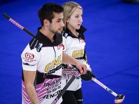 Kadriana and Colton Lott discuss strategy at the Canadian Mixed Doubles Curling Championship in Calgary, Wednesday, March 24, 2021. The team was ousted from the world mixed doubles curling championship after suffering a 6-5 loss to Estonia in a playoff qualification game on Friday.THE CANADIAN PRESS/Jeff McIntosh