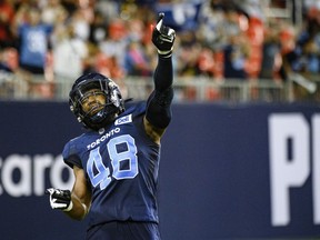 Toronto Argonauts linebacker Wynton McManis (48) celebrates during a break in play against the Hamilton Tiger-Cats during CFL action in Toronto on Friday, August 26, 2022. It's as much a part of McManis as his infectious laugh and fun-loving personality. No matter where the veteran linebacker goes, he'll always have a toothpick. If it's not in his mouth, it can usually be found tucked behind his ear.