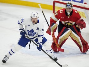 Auston Matthews' quest for his 70th goal of the season prompts a look back at key scoring milestones in Toronto Maple Leafs history, from Ace Bailey's first scoring title to Darryl Sittler's record-breaking game. Matthews (34) looks on in front of Florida Panthers goaltender Anthony Stolarz (41) during first-period NHL hockey action in Sunrise, Fla. on Tuesday, April 16, 2024.