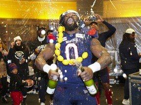 Montreal Alouettes defensive end Shawn Lemon (0) celebrates in the dressing room after the Alouettes defeated the Winnipeg Blue Bombers to win the 110th CFL Grey Cup in Hamilton, Ont., on Sunday, Nov.19, 2023. The CFL has suspended veteran defensive lineman Lemon indefinitely for betting on league games.Lemon, a three-time Grey Cup champion, retired April 10.
