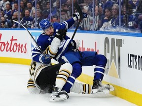 Boston Bruins' Charlie McAvoy takes down Toronto Maple Leafs' Auston Matthews during NHL playoff action in Toronto on Wednesday, April 24, 2024. Matthews will be alongside his teammates in Boston.Whether the Maple Leafs sniper is on the ice with Toronto facing elimination is a massive question mark.THE CANADIAN PRESS/Nathan Denette