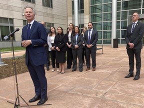 U.S. Attorney for Colorado Cole Finegan, left, speaks outside Denver federal court after the sentencing of Jared Sebastian Dalke on Monday, April 29, 2024, in Denver. Behind him are federal prosecutors and FBI Special Agent in Charge Mark Michalek. Former National Security Agency employee Dalke, who sold classified information to an undercover FBI agent he believed to be a Russian official, was sentenced Monday to nearly 22 years in prison, the penalty requested by government prosecutors.