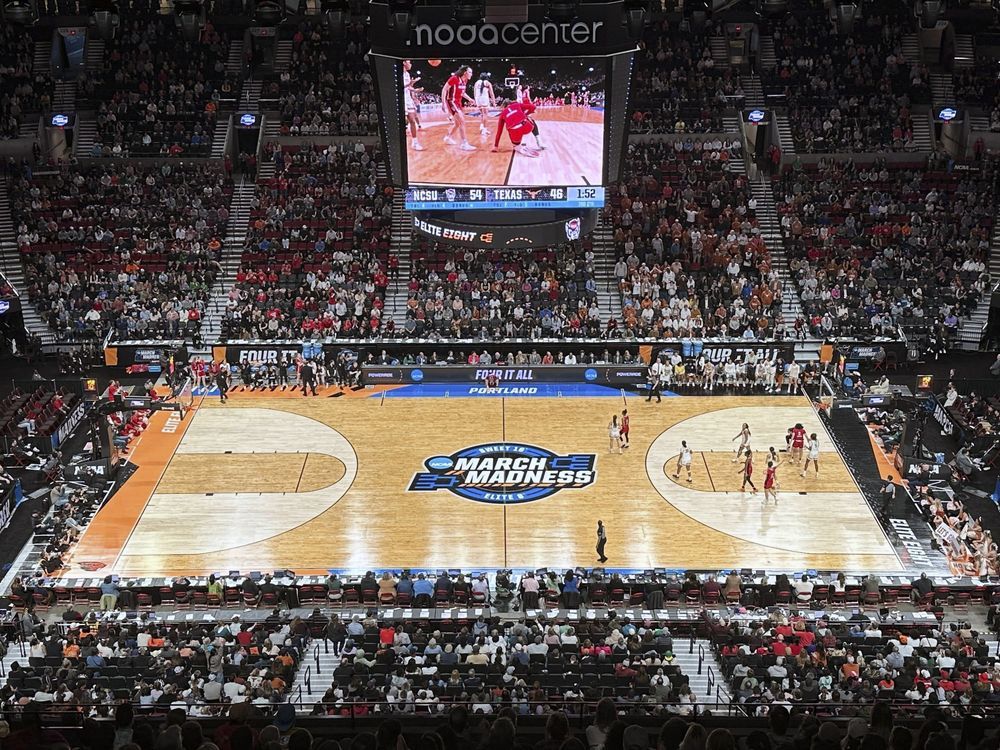 NextImg:NCAA says a 3-point line was drawn 9 inches short at Portland women's regional by court supplier
