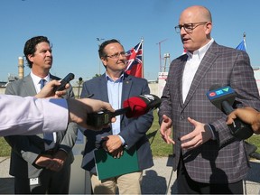 'Keep the mayor happy at all costs.' In this Aug. 31, 2022, file photo, Chris Nepszy, left, city engineer and commissioner of infrastructure services for the City of Windsor, Windsor-Tecumseh MP Irek Kusmierczyk and Windsor Mayor Drew Dilkens are shown at a press conference at the Lou Romano Water Reclamation Plant.