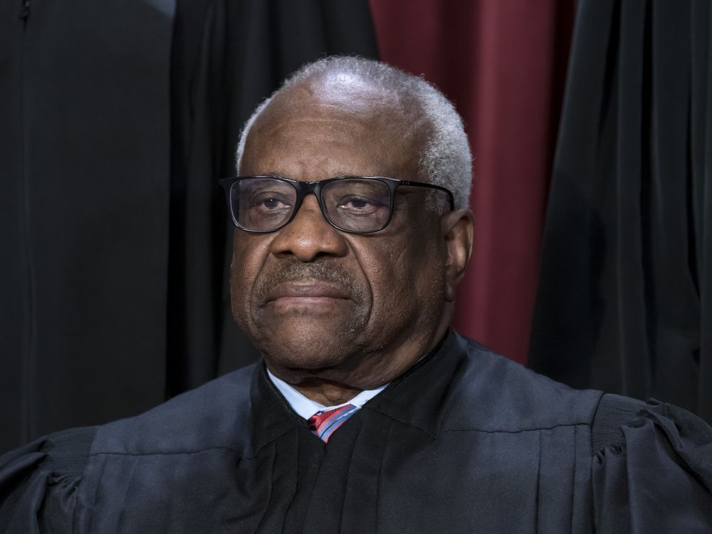 NextImg:U.S. Supreme Court Justice Clarence Thomas absent from court without explanation