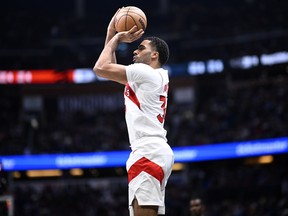 Toronto Raptors' Jontay Porter attempts a 3-point shot during the second half of an NBA basketball game against the Orlando Magic, Sunday, March 17, 2024, in Orlando, Fla. The NBA has banned Porter for life after completing an investigation into gambling allegations against the Raptors two-way player.THE CANADIAN PRESS/AP/Phelan M. Ebenhack